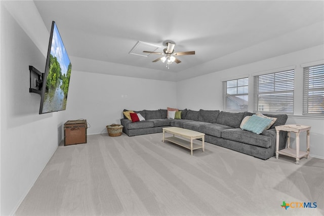 living room featuring light carpet and ceiling fan