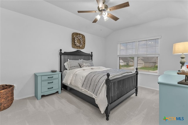 carpeted bedroom featuring ceiling fan and lofted ceiling