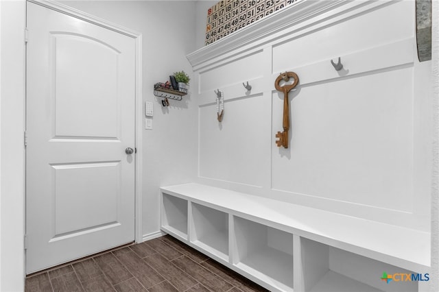 mudroom with dark hardwood / wood-style flooring