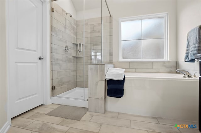 bathroom featuring lofted ceiling and plus walk in shower