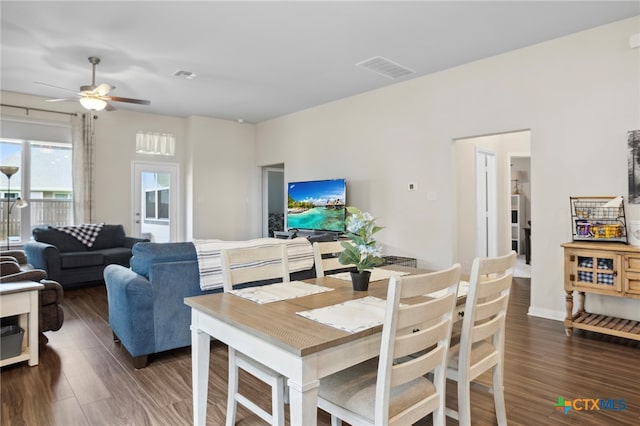 dining area featuring dark hardwood / wood-style flooring and ceiling fan