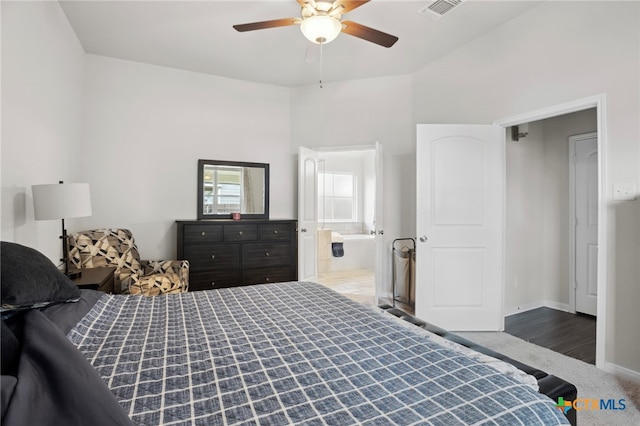 bedroom with ensuite bathroom, ceiling fan, and wood-type flooring