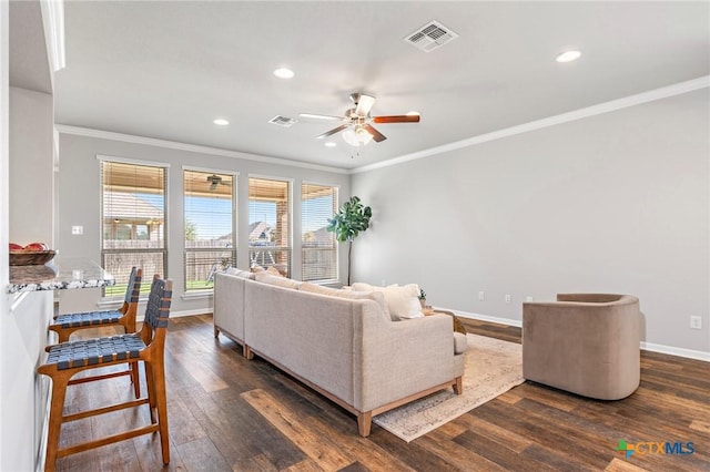 living room featuring ceiling fan, dark wood-type flooring, and ornamental molding