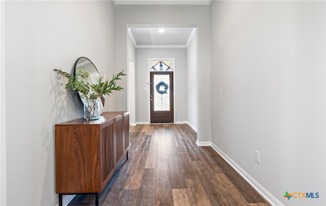 entrance foyer with crown molding and dark hardwood / wood-style flooring