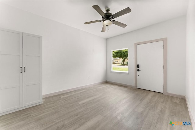 1814 S 5th St, Temple, TX 76504 - foyer entrance with light wood-style flooring and ceiling fan