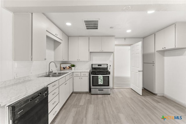 1814 S 5th St, Temple, TX 76504 - kitchen featuring stainless steel gas range, black dishwasher, light wood-type flooring, recessed lighting, and white cabinetry