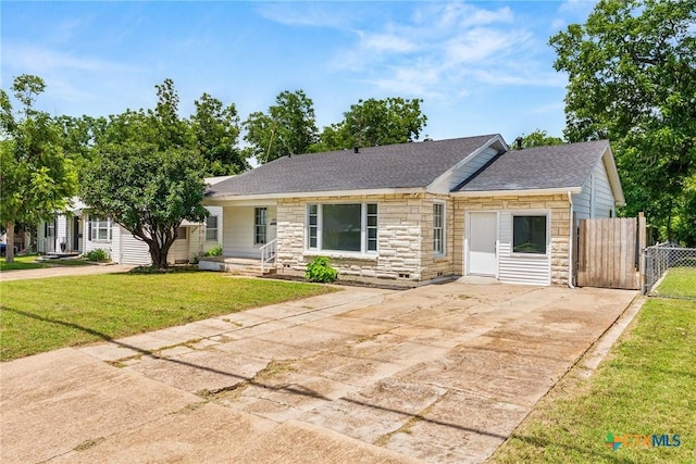 1814 S 5th St, Temple, TX 76504 - ranch-style home with stone siding, concrete driveway, and a shingled roof