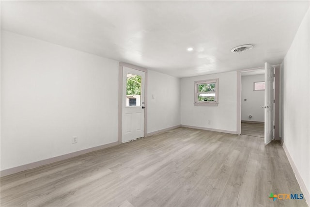 1814 S 5th St, Temple, TX 76504 - unfurnished living room featuring light wood-type flooring and baseboards