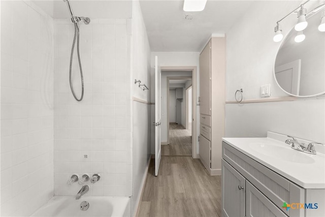 1814 S 5th St, Temple, TX 76504 - bathroom featuring vanity, shower / tub combination, and wood finished floors