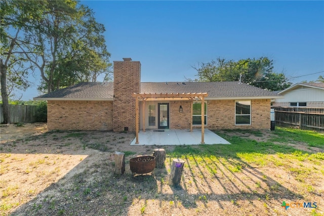4013 Valley View Dr, Temple, TX 76502 - rear view of house featuring a pergola, a fenced backyard, a patio area, a chimney, and brick siding