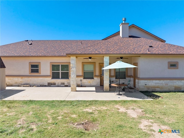 back of house featuring a yard, ceiling fan, and a patio area