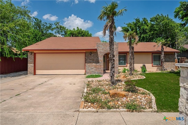 409 W Mary Jane Dr, Killeen, TX 76541 - ranch-style home with driveway, an attached garage, and brick siding
