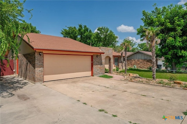 409 W Mary Jane Dr, Killeen, TX 76541 - single story home with brick siding, an attached garage, and concrete driveway