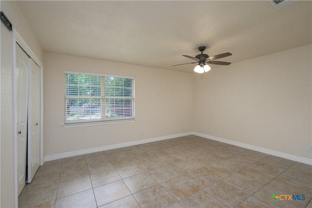 409 W Mary Jane Dr, Killeen, TX 76541 - unfurnished bedroom featuring a closet, light tile patterned flooring, and a ceiling fan