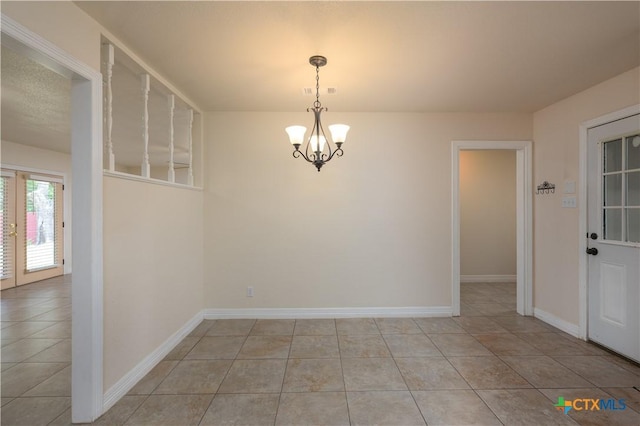 409 W Mary Jane Dr, Killeen, TX 76541 - spare room featuring a chandelier and light tile patterned floors