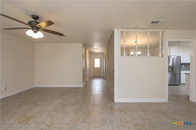 409 W Mary Jane Dr, Killeen, TX 76541 - empty room featuring light tile patterned flooring, a ceiling fan, and a chandelier