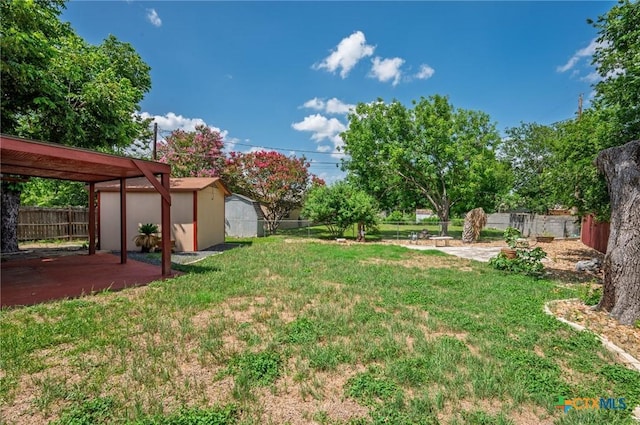 409 W Mary Jane Dr, Killeen, TX 76541 - fenced backyard with a storage unit and a patio area