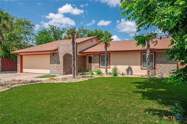 409 W Mary Jane Dr, Killeen, TX 76541 - single story home featuring a garage, concrete driveway, and brick siding
