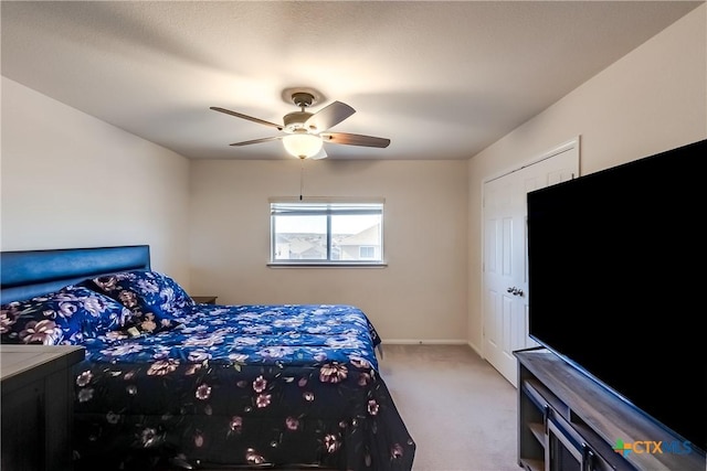 carpeted bedroom featuring ceiling fan