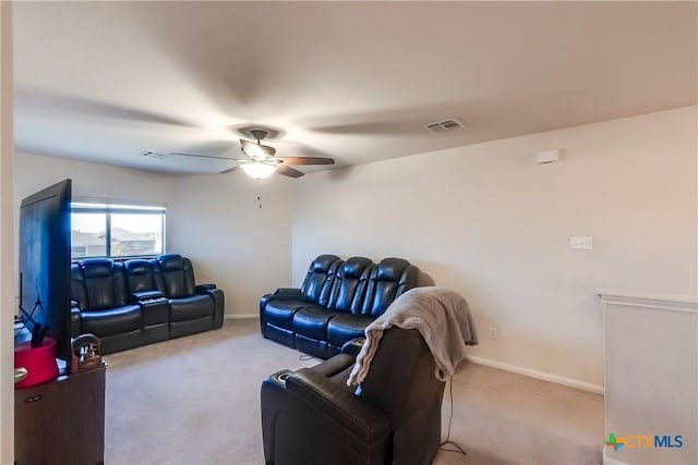 carpeted living room with ceiling fan