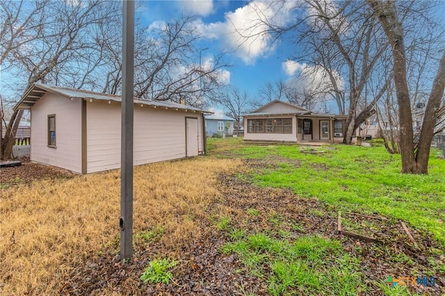 view of yard with a sunroom