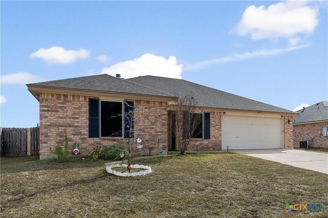 ranch-style home featuring a garage and a front lawn