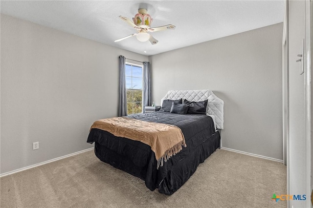 bedroom featuring carpet, baseboards, and ceiling fan