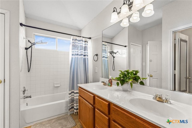 bathroom featuring shower / bath combo, a sink, lofted ceiling, and double vanity