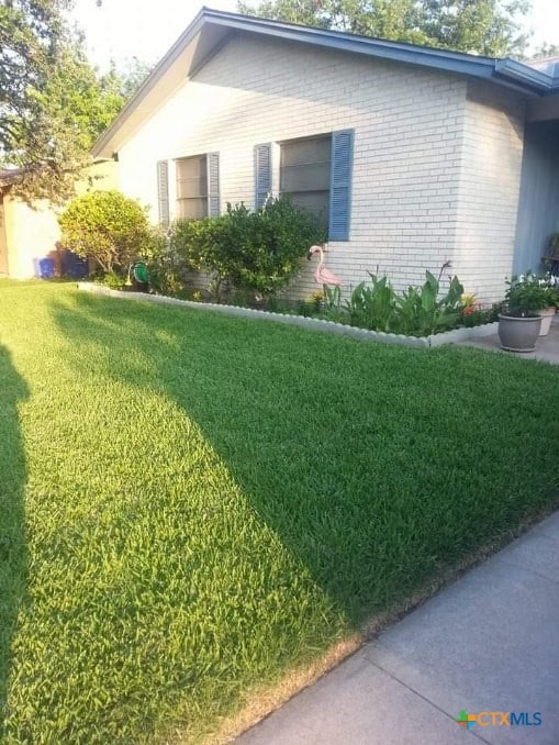 view of home's exterior with a lawn