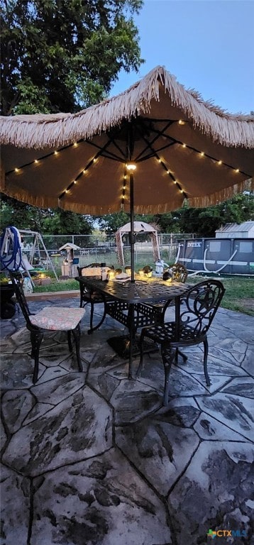 view of patio terrace at dusk