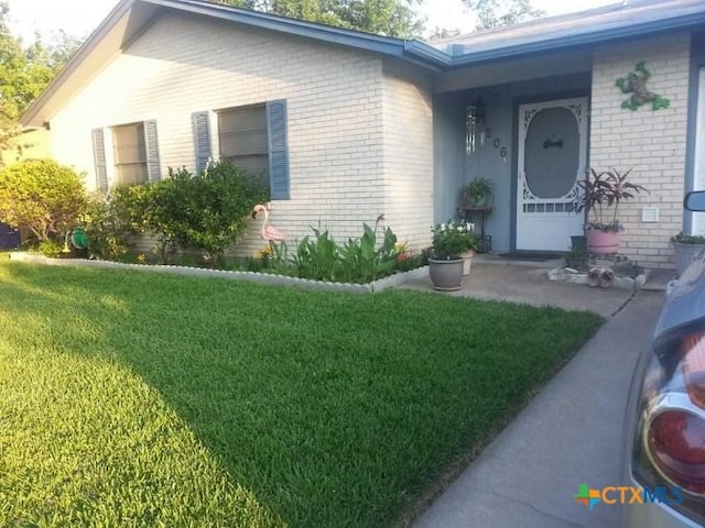 exterior space with a yard