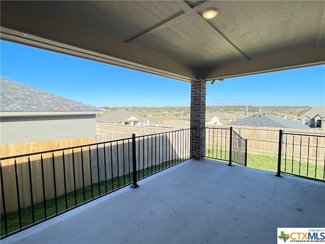 view of patio with a balcony