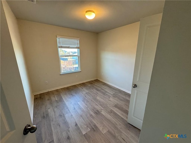 empty room featuring light hardwood / wood-style floors