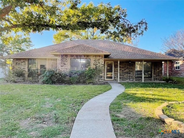 single story home featuring a front yard