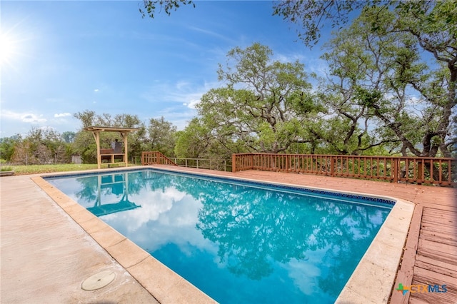 pool with a wooden deck