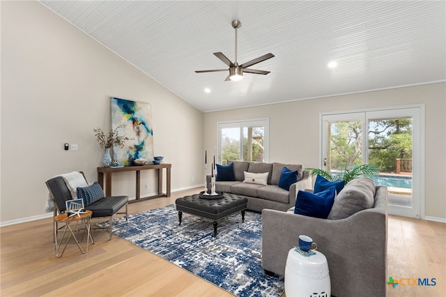 living room featuring light wood finished floors, baseboards, a ceiling fan, and recessed lighting