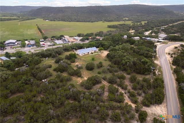 bird's eye view featuring a rural view and a mountain view