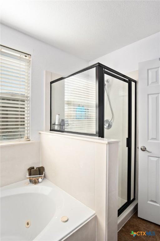 5607 Schorn Dr, Killeen, TX 76542 - bathroom featuring a stall shower and a jetted tub