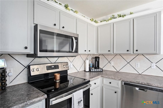 5607 Schorn Dr, Killeen, TX 76542 - kitchen with stainless steel appliances, tasteful backsplash, and white cabinets