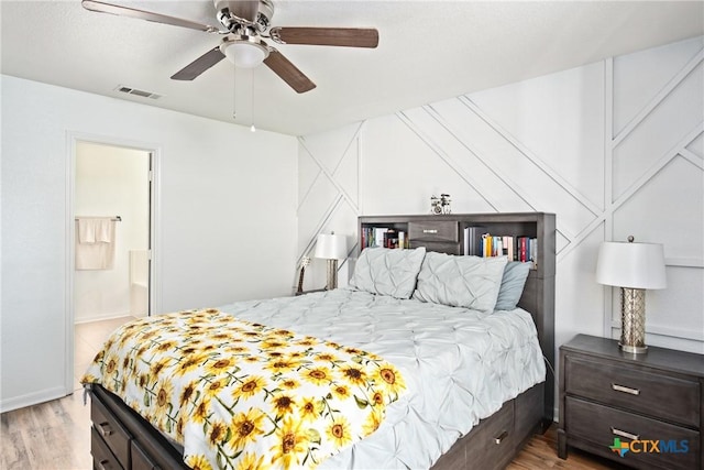 5607 Schorn Dr, Killeen, TX 76542 - bedroom featuring light wood-style flooring, a ceiling fan, and connected bathroom