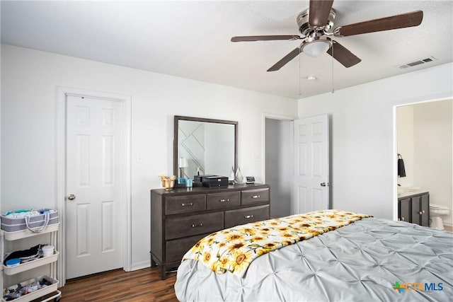 5607 Schorn Dr, Killeen, TX 76542 - bedroom featuring dark wood-style floors, connected bathroom, and ceiling fan