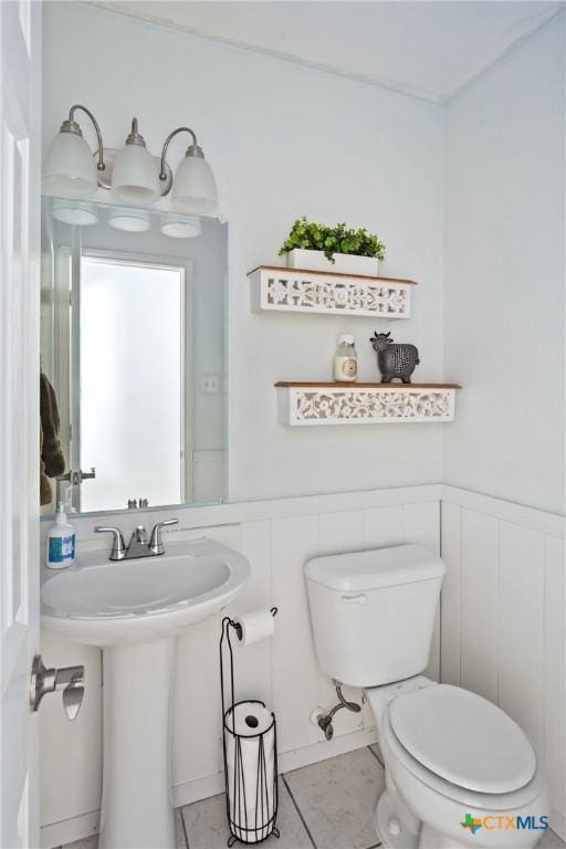 5607 Schorn Dr, Killeen, TX 76542 - half bathroom with toilet, tile patterned flooring, and wainscoting