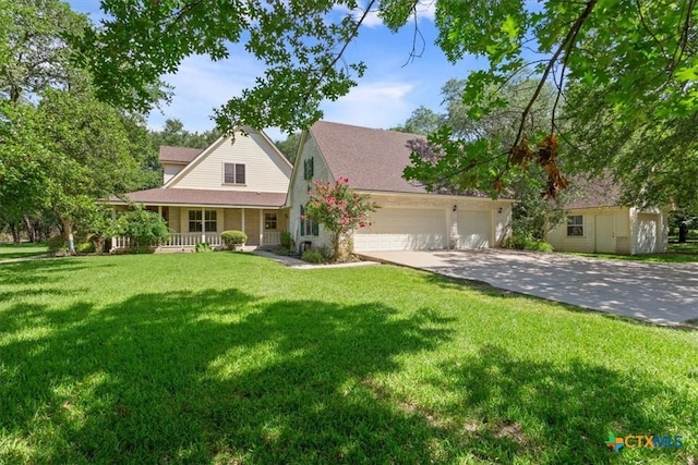 11740 Stinnett Mill Rd, Salado, TX 76571 - view of front of property featuring covered porch, an attached garage, driveway, and a front lawn