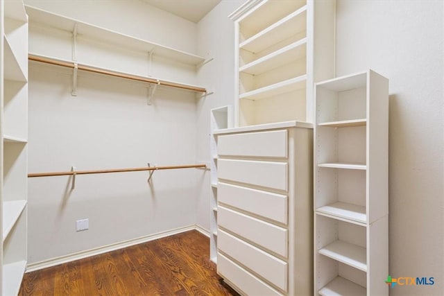11740 Stinnett Mill Rd, Salado, TX 76571 - walk in closet with dark wood-style flooring