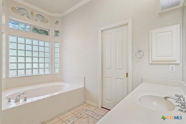 11740 Stinnett Mill Rd, Salado, TX 76571 - bathroom with a bath, crown molding, tile patterned floors, and vanity