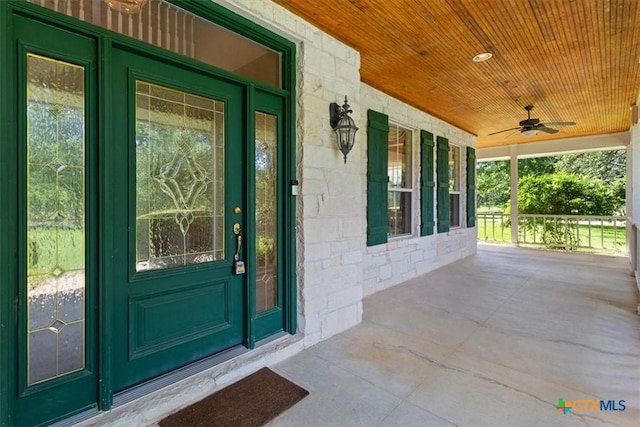 11740 Stinnett Mill Rd, Salado, TX 76571 - property entrance with a porch, stone siding, and ceiling fan