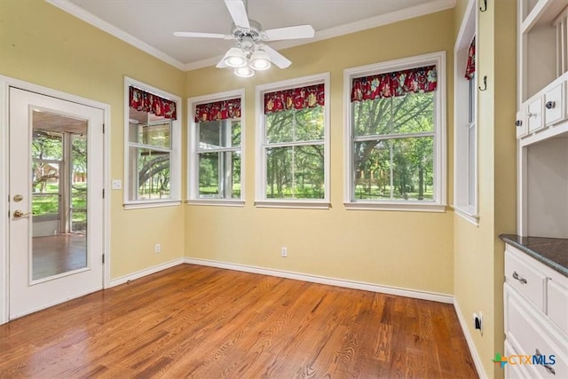 11740 Stinnett Mill Rd, Salado, TX 76571 - unfurnished sunroom with wood finished floors and crown molding