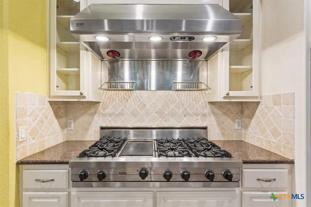 11740 Stinnett Mill Rd, Salado, TX 76571 - kitchen with designer range, glass insert cabinets, extractor fan, and tasteful backsplash