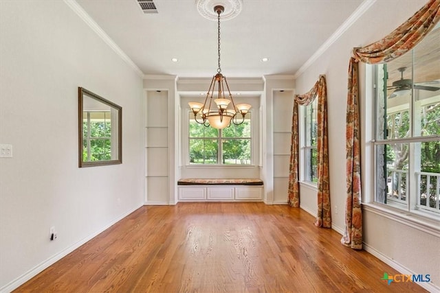 11740 Stinnett Mill Rd, Salado, TX 76571 - unfurnished dining area featuring plenty of natural light, a chandelier, light wood-style floors, and crown molding