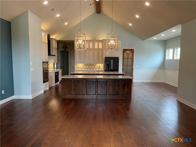 750 Mission Hts, New Braunfels, TX 78130 - kitchen with visible vents, an inviting chandelier, a large island, light countertops, and fridge with ice dispenser